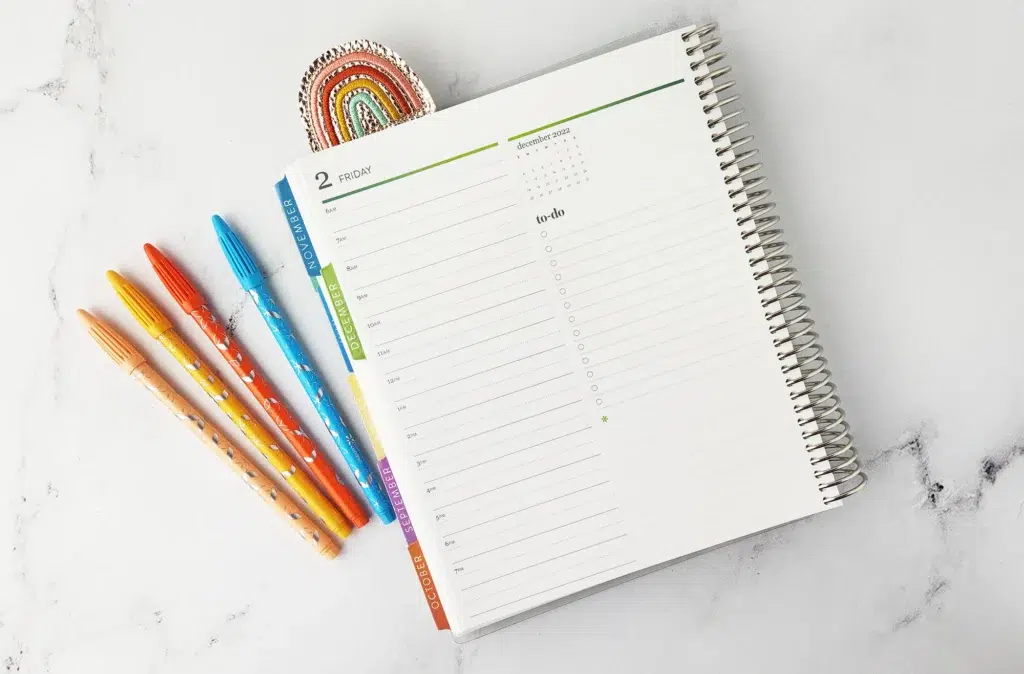 erin condren daily duo planner with colorful markers