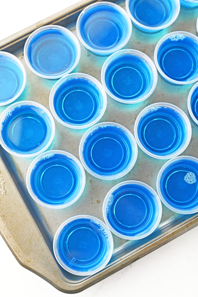 blue jello shots on a sheet pan