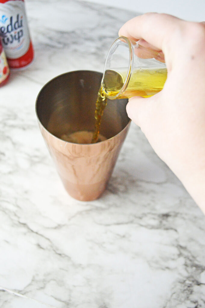 Jameson pouring into a cocktail shaker