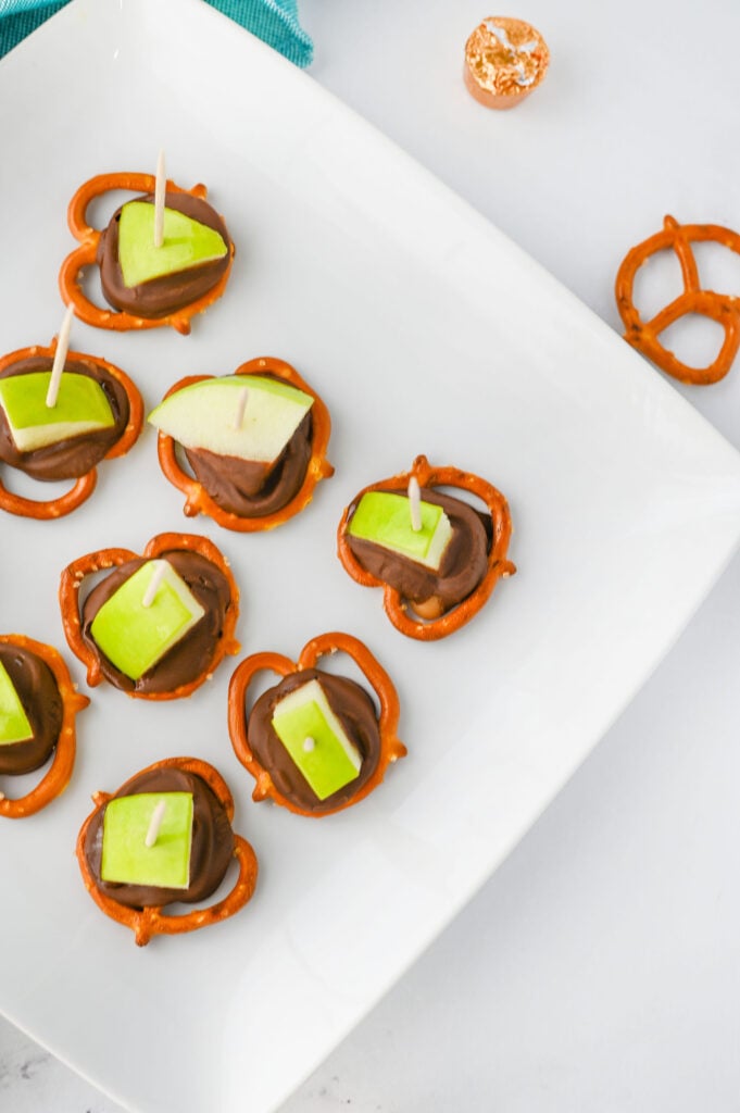 Caramel Apple Bites - pretzels topped with Rolo candies, melted, and topped with a granny smith apple chunk