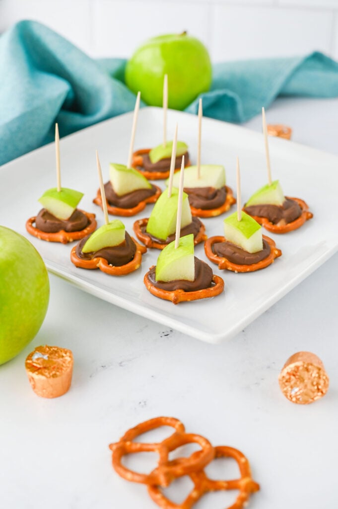 Caramel Apple Bites - pretzels topped with Rolo candies, melted, and topped with a granny smith apple chunk