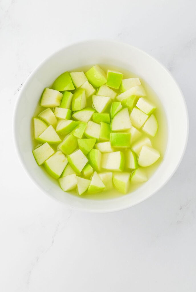 apple chunks soaking in lime juice