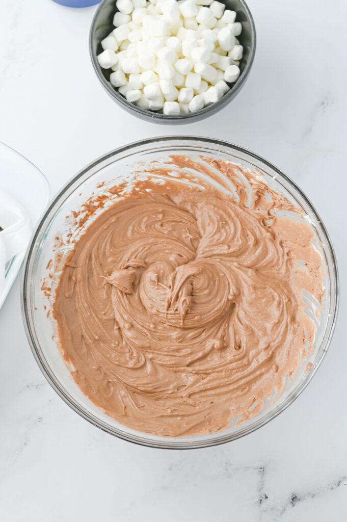 hot chocolate cheesecake mixture in a mixing bowl