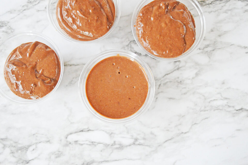chocolate pudding in plastic cups