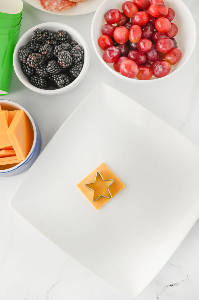 Cheese slice cut into star shapes with a star cookie cutter.