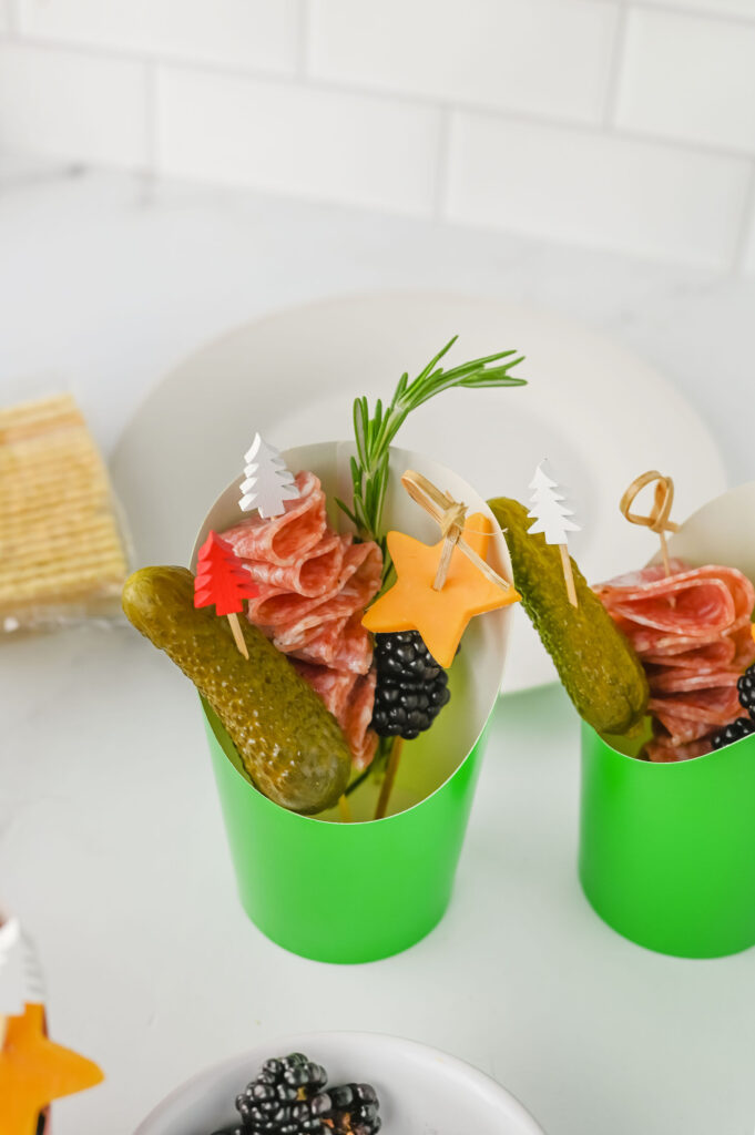 Charcuterie cup with skewers of different heights to create visual interest.