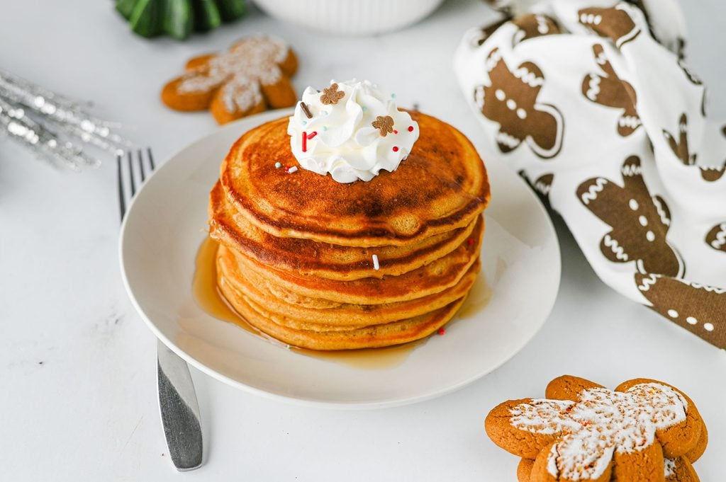 Stack of gingerbread pancakes made with molasses, cinnamon, and ginger.