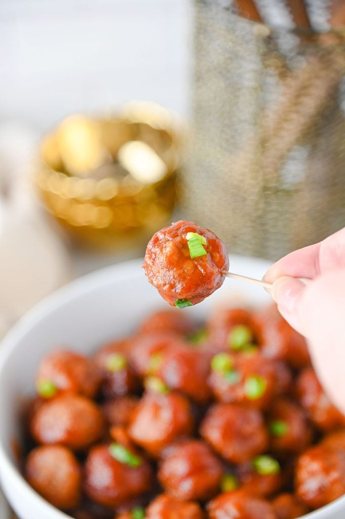 Crockpot cranberry meatballs made with frozen meatballs, cranberry sauce, and chili sauce