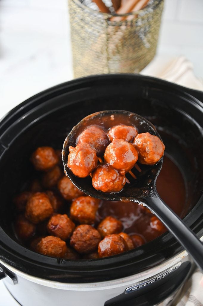 Slow cooker cranberry meatballs covered in a glossy cranberry chili sauce