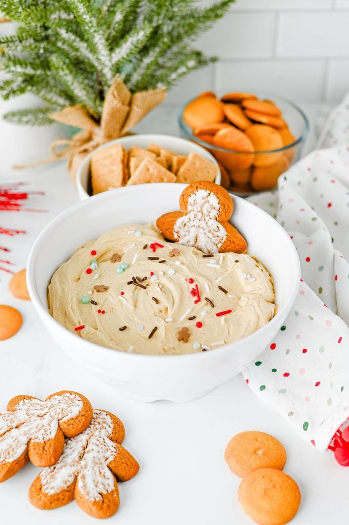 Creamy gingerbread dip topped with festive gingerbread sprinkles and served with cookies for dipping