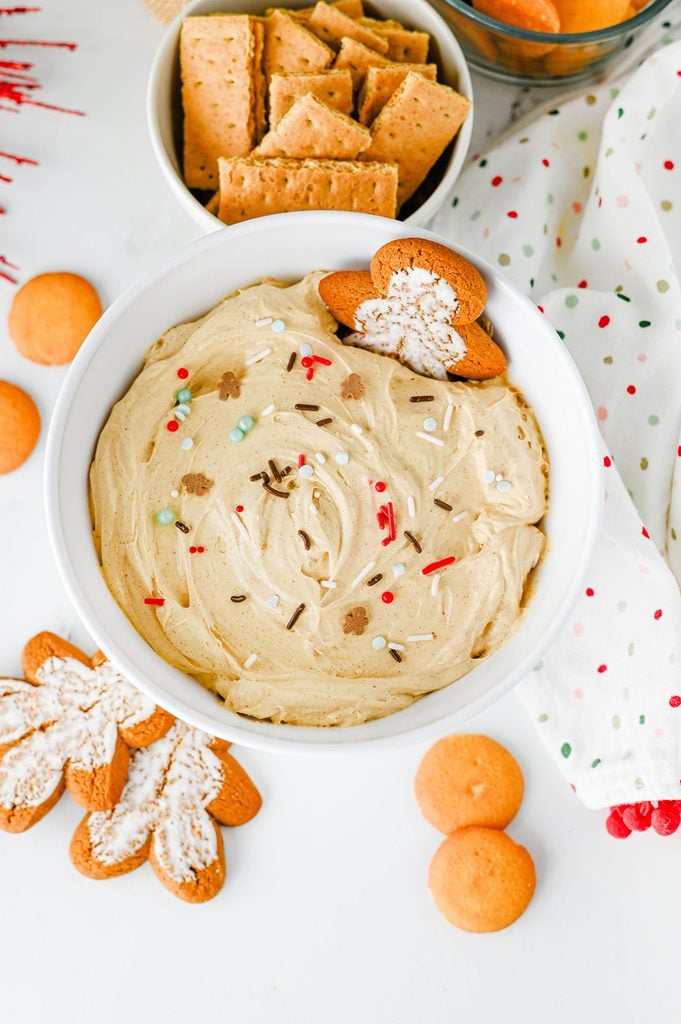 Easy gingerbread dessert dip with gingerbread sprinkles served with graham crackers and vanilla wafers