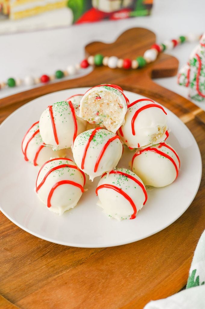Inside of a Little Debbie Christmas Tree Cake Truffle showing the cake mixture beneath the white chocolate coating.