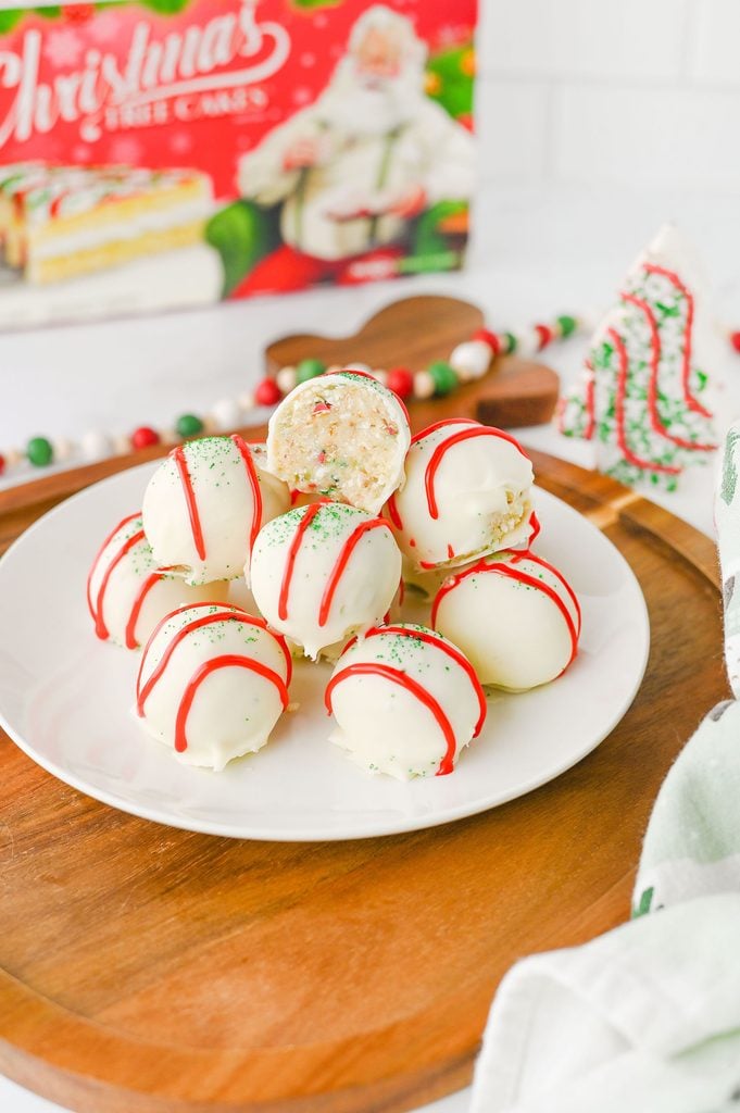 Christmas Tree Cake Truffle cut in half to reveal the soft, creamy cake and cream cheese filling.
