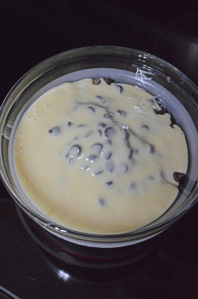 Semi-sweet chocolate chips and sweetened condensed milk added to a double boiler.