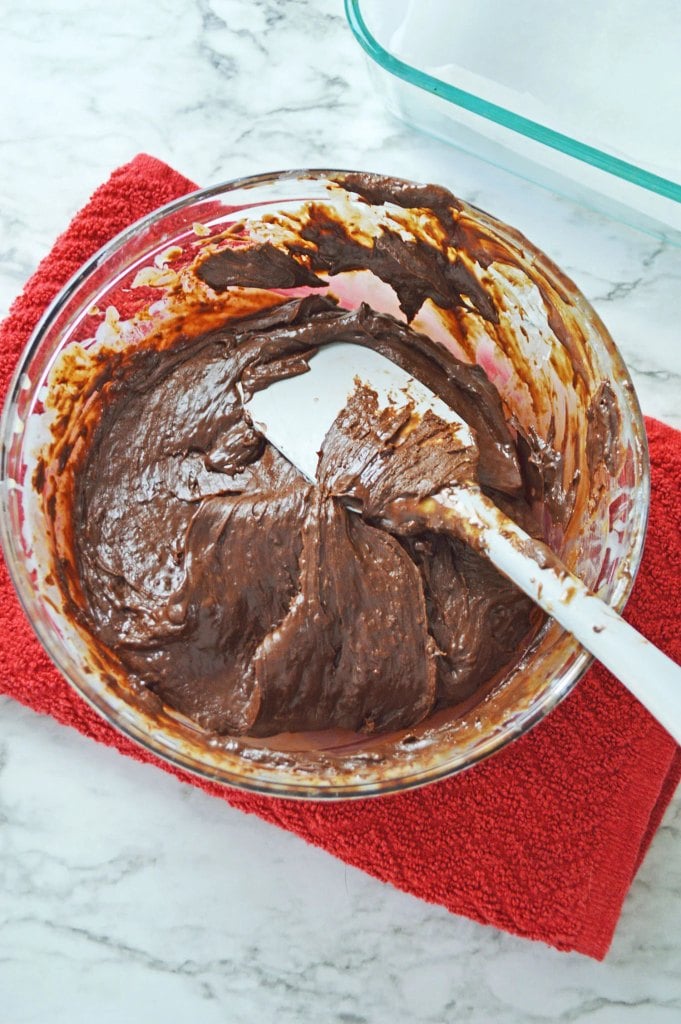 Thick melted chocolate fudge mixture ready to transfer to a baking pan.