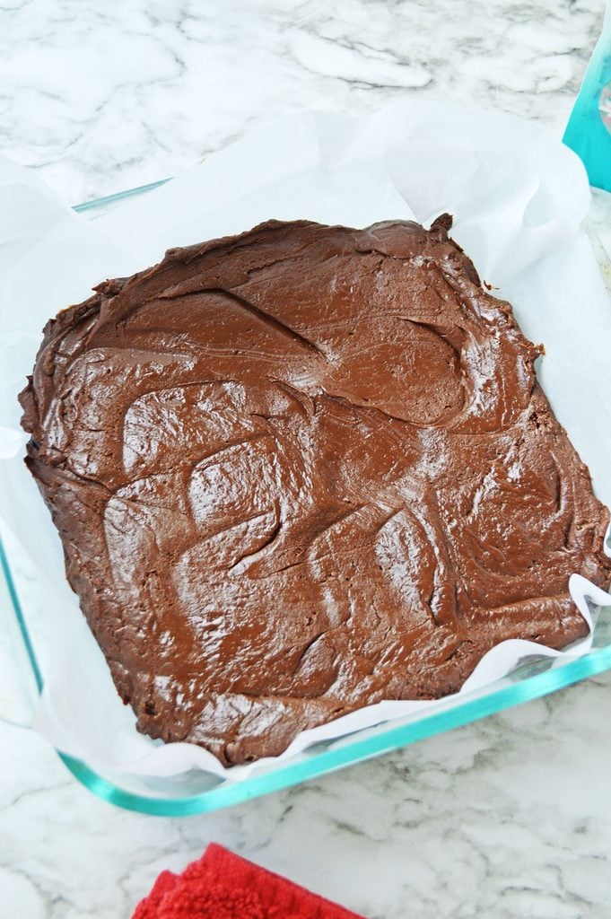 Chocolate fudge spread evenly into an 8x8-inch baking pan.