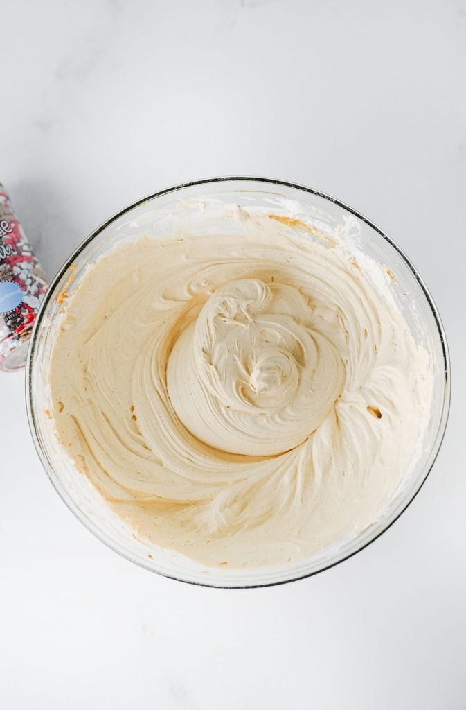 Cool Whip being mixed into the spiced cream cheese mixture for gingerbread dip