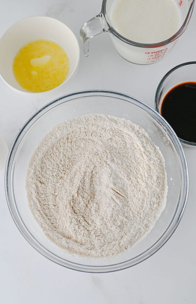 Dry ingredients mixed together in a bowl for gingerbread pancake batter.