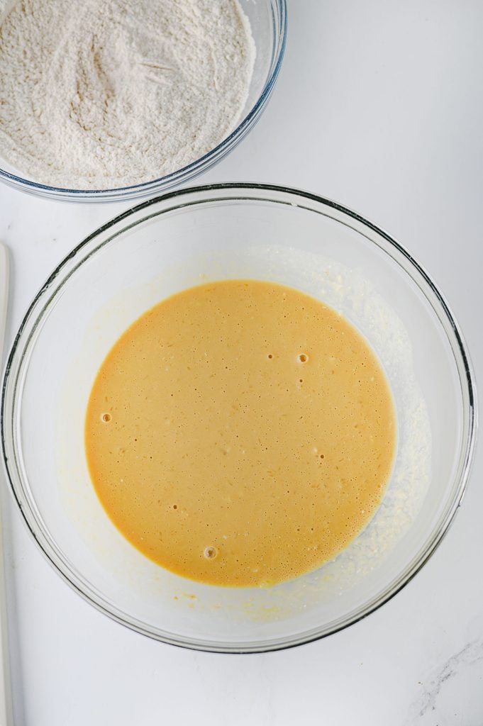 Buttermilk, egg, melted butter, and molasses combined for homemade gingerbread pancakes.