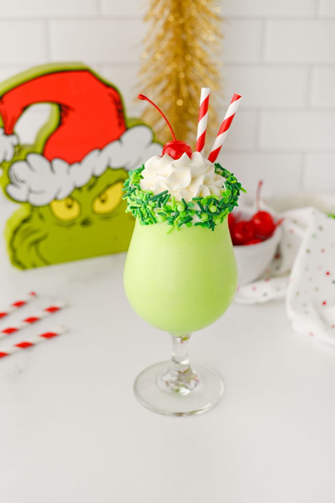 1. Creamy green milkshake with whipped cream and a red cherry on top