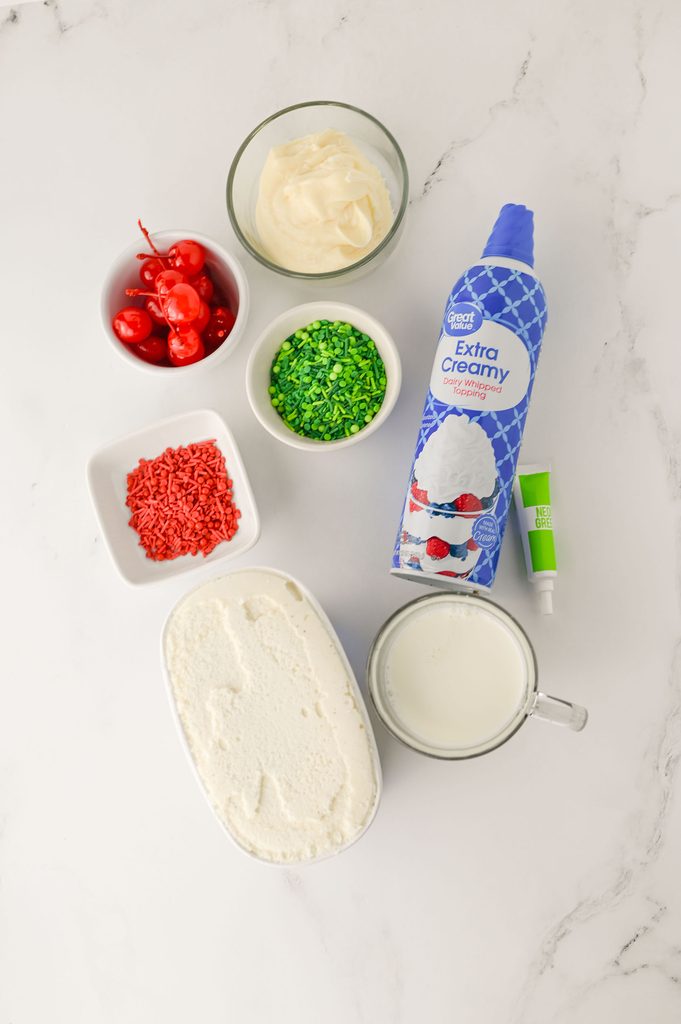 Vanilla ice cream, milk, green food coloring, and milkshake toppings