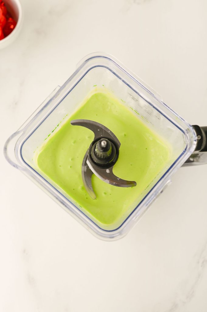Vanilla ice cream and milk being blended together