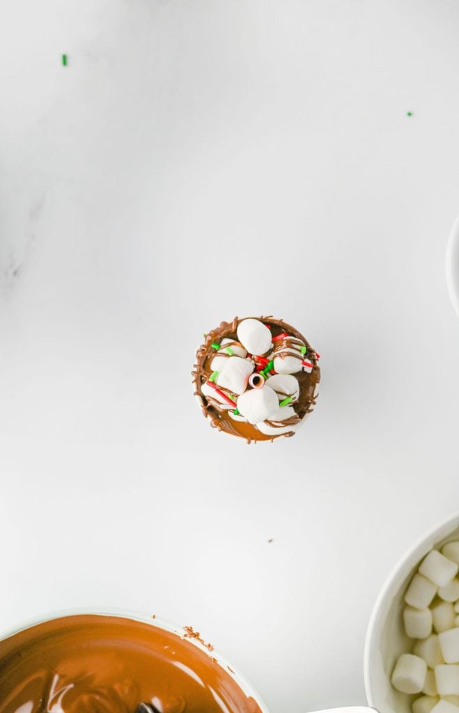 Festive Christmas sprinkles decorating homemade hot chocolate sticks