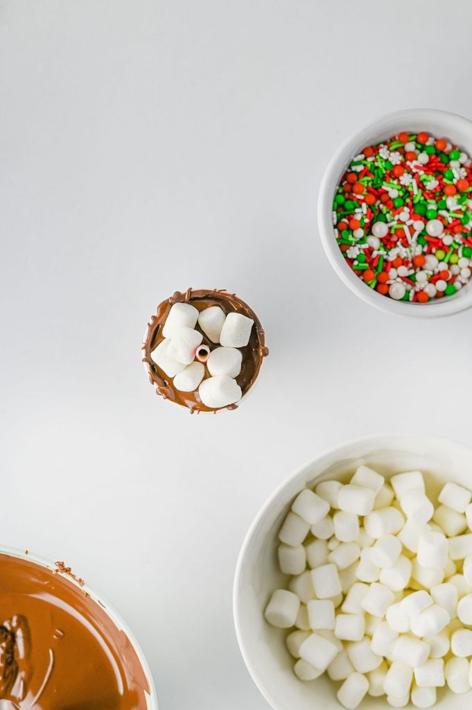 Mini marshmallows added to homemade chocolate sticks before the chocolate sets