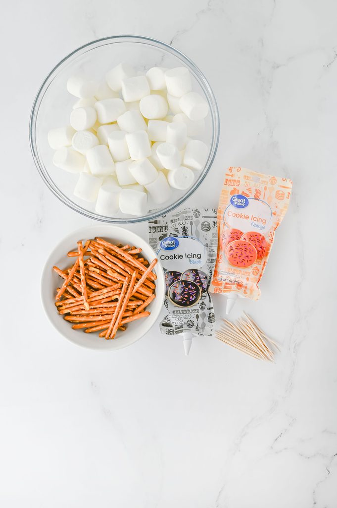 Jumbo marshmallows, pretzel sticks, toothpicks, and cookie icing