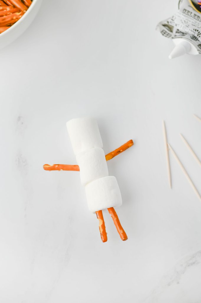 Pretzel arms and legs added to a jumbo marshmallow snowman
