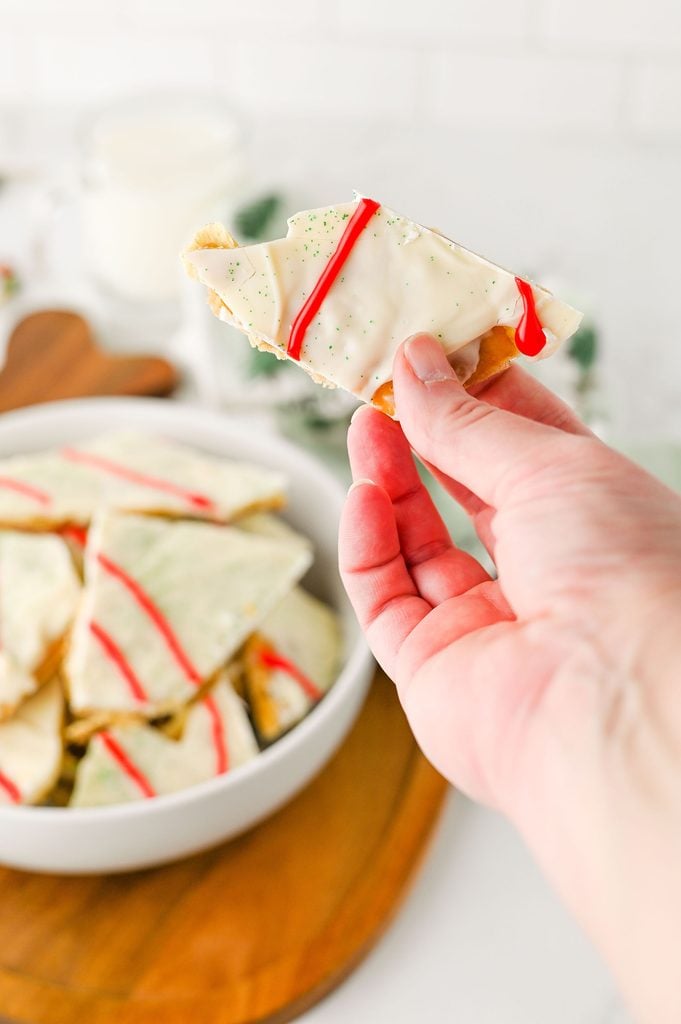 Christmas Tree Cake-inspired toffee bark with a crunchy cracker base and creamy white chocolate topping.