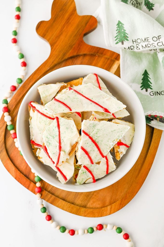 Pieces of Christmas Tree Cake Crack made with buttery saltine cracker toffee and festive white chocolate.